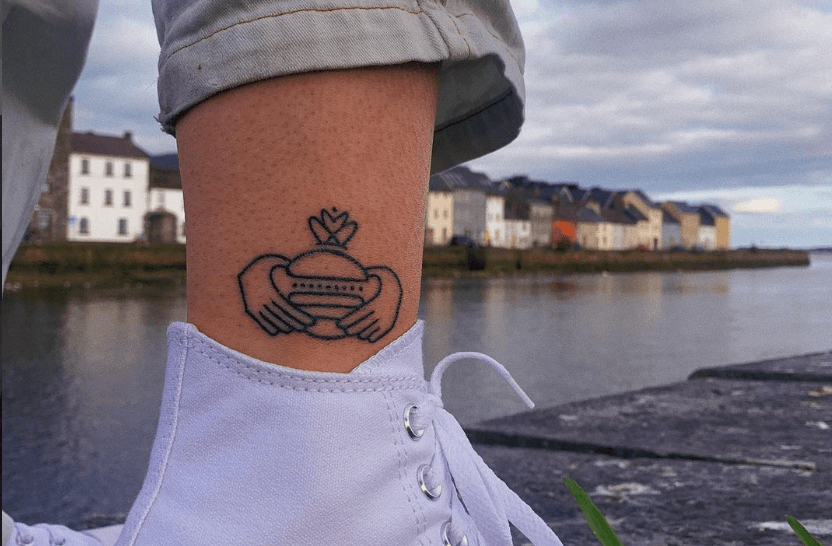 Handsome Burger will give the first person to get their logo tattooed free burgers for life