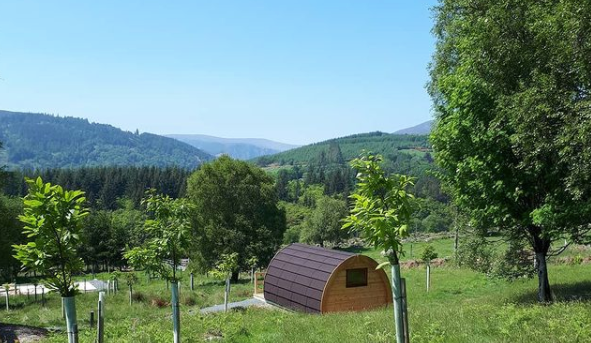 glamping pod with hills and scenery of Glendalough in the background