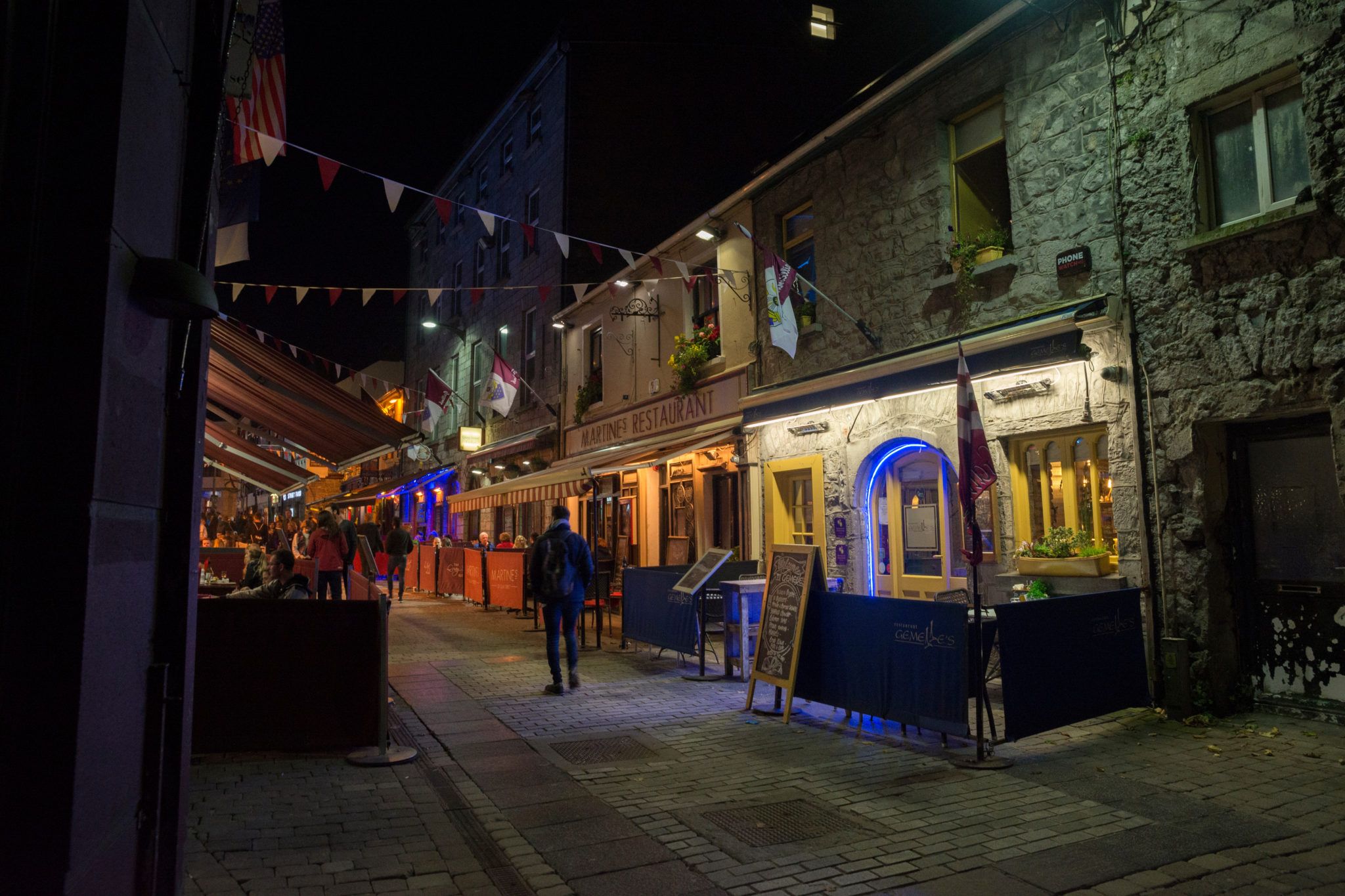 shot of pubs and restaurants on a street in Galway city