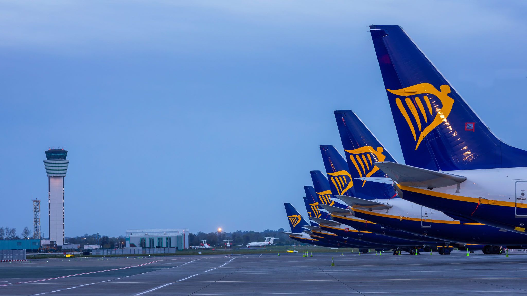 several ryanair planes parked beside each other in airport