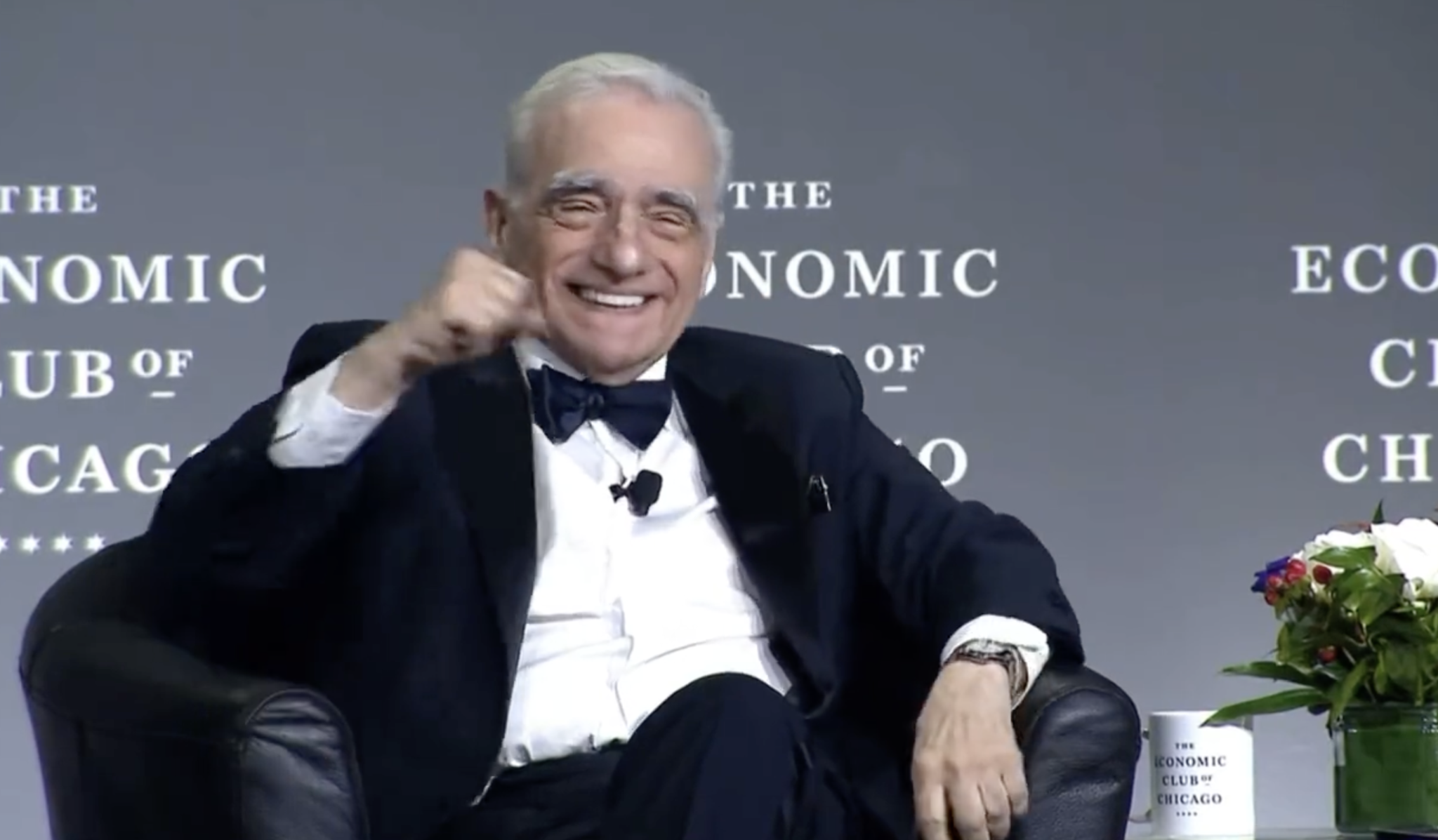 martin scorsese smiling and punching the air during an interview