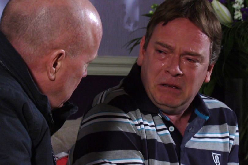 still from eastenders, which shows ian beale crying to phil mitchell