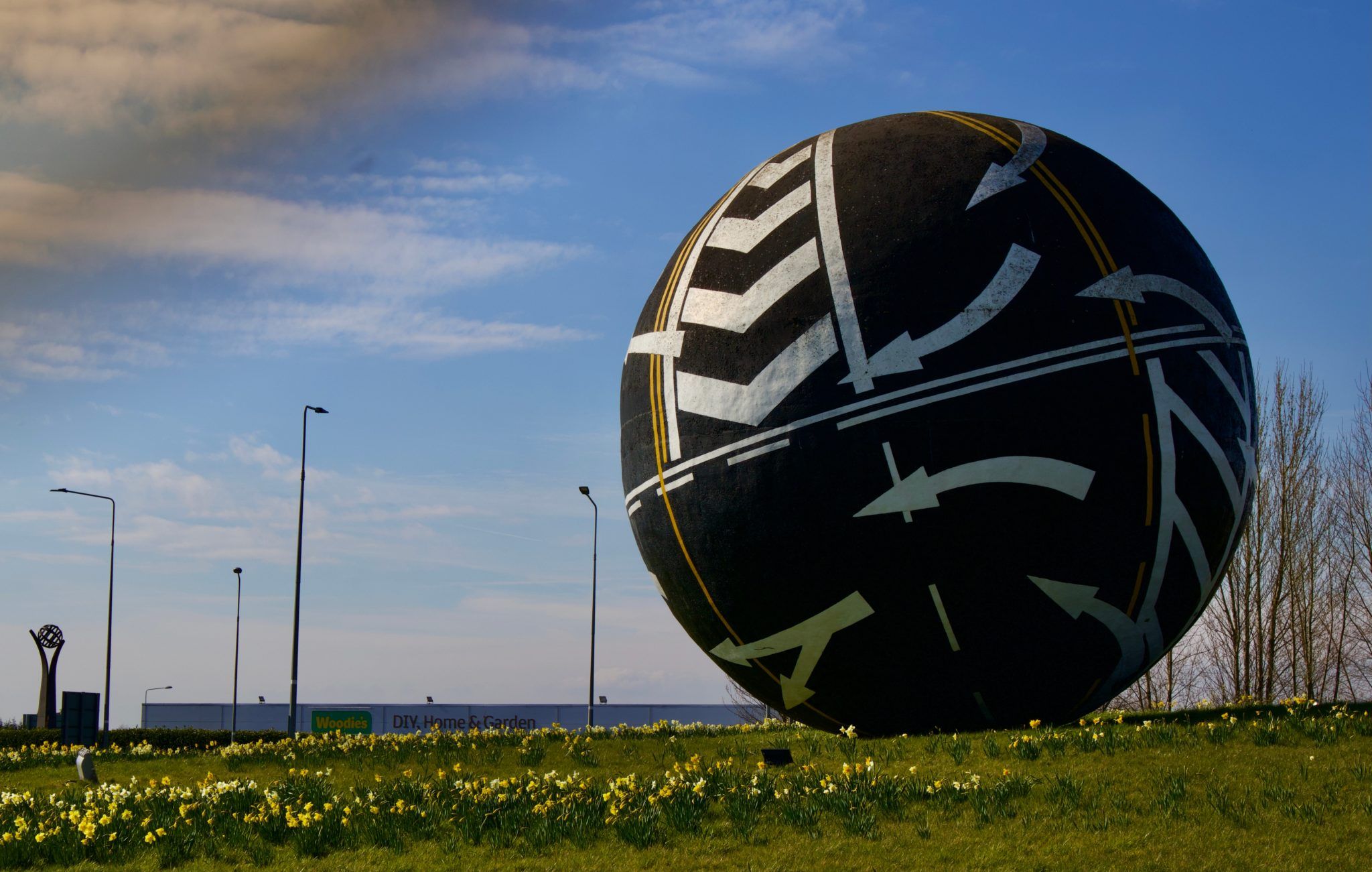 the naas ball, a large spherical sculpture on a roundabout decorated with road markings