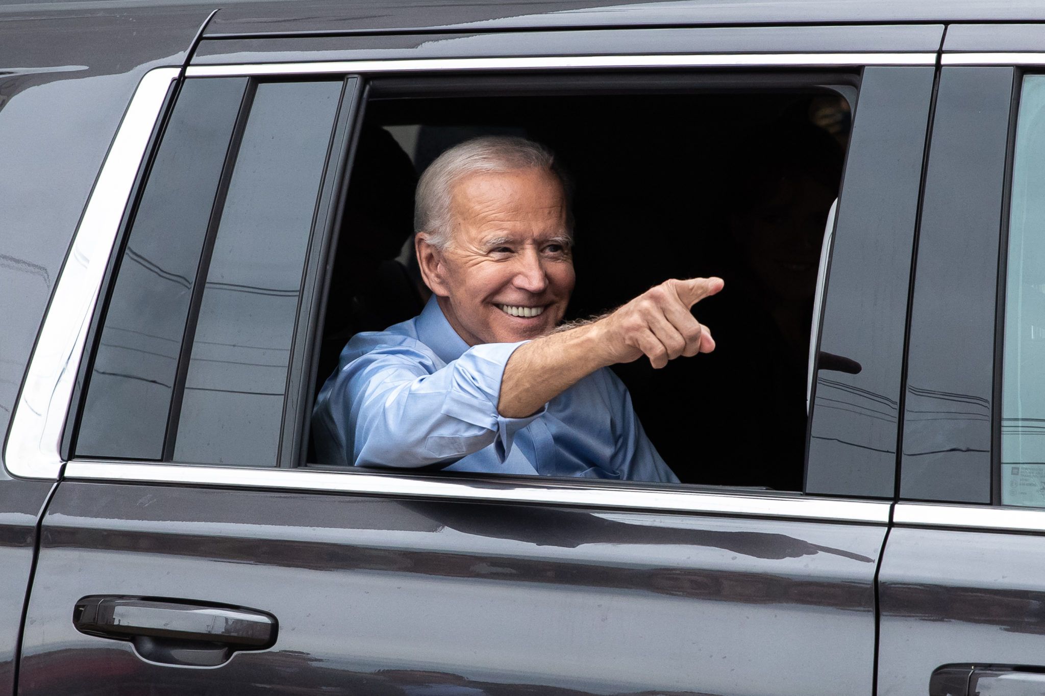 US President Joe Biden in the back seat of a car